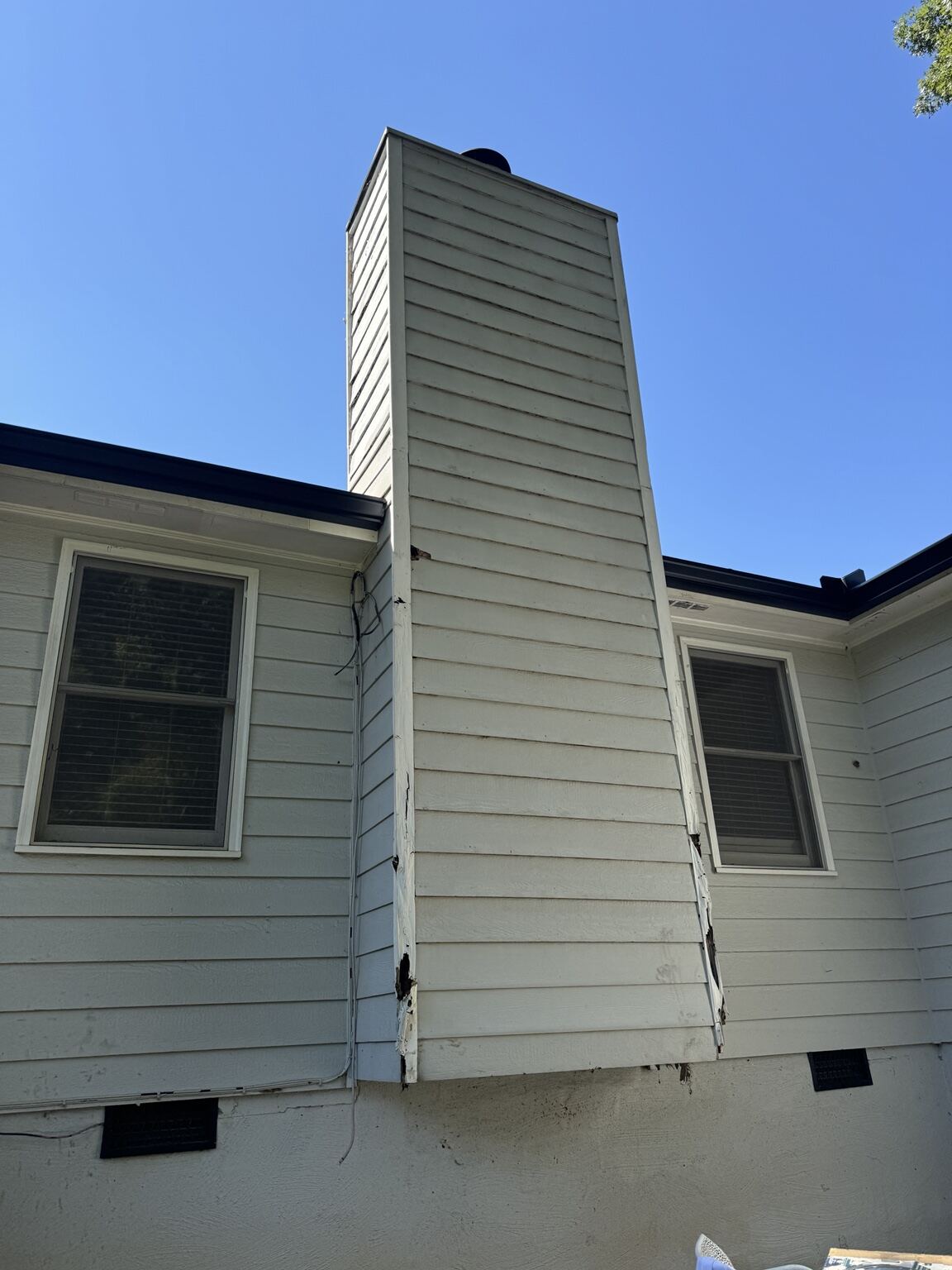 Completed roofline and chimney chase wood repair