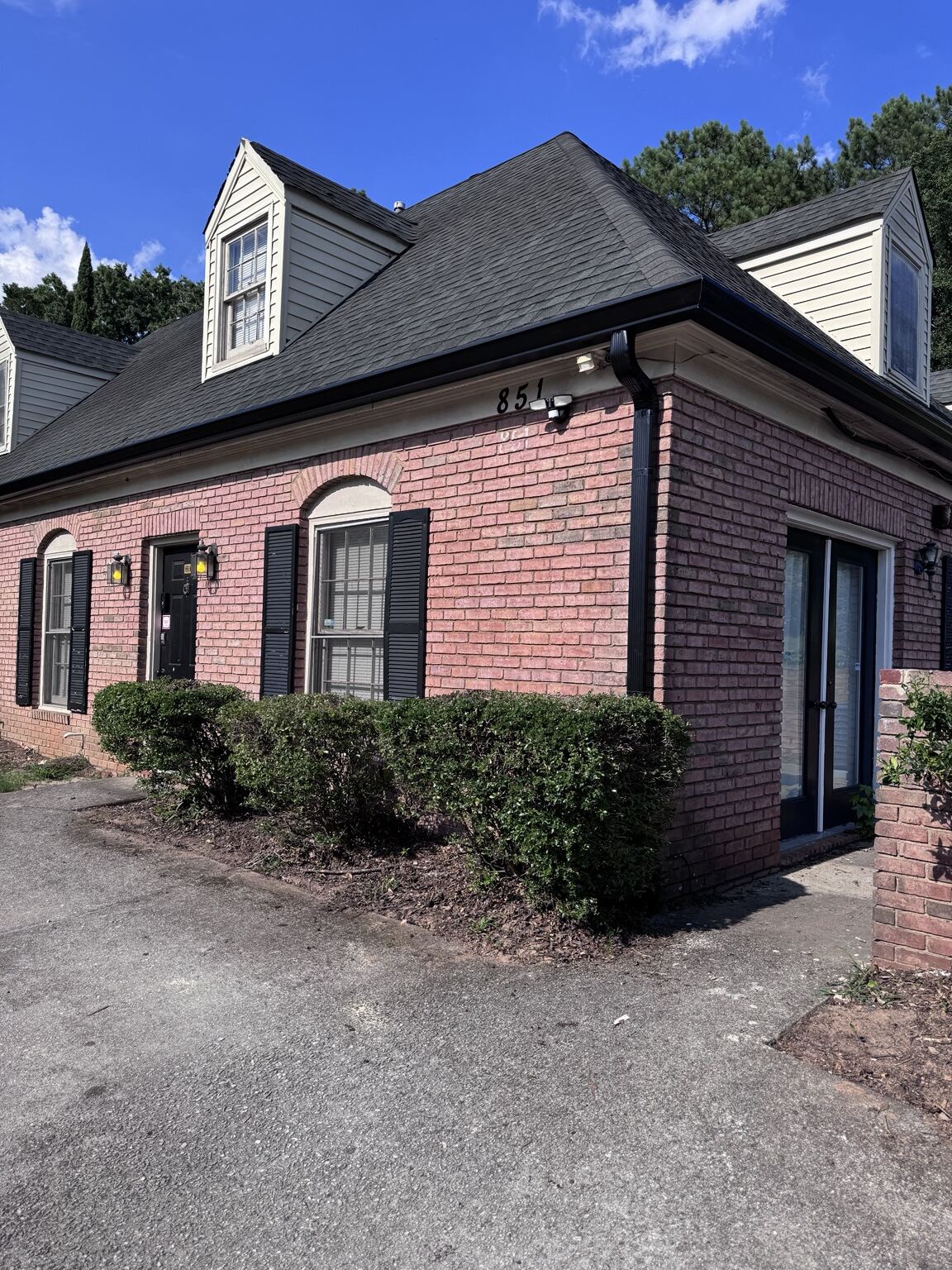 Brick multifamily building with completed fascia, gutter and downspout work by Mr B's Gutters